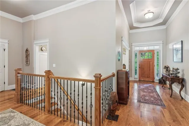 a living room with fireplace furniture and a large window