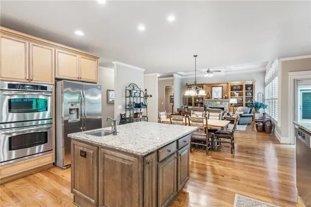 a bathroom with a bathtub shower sink vanity mirror and toilet