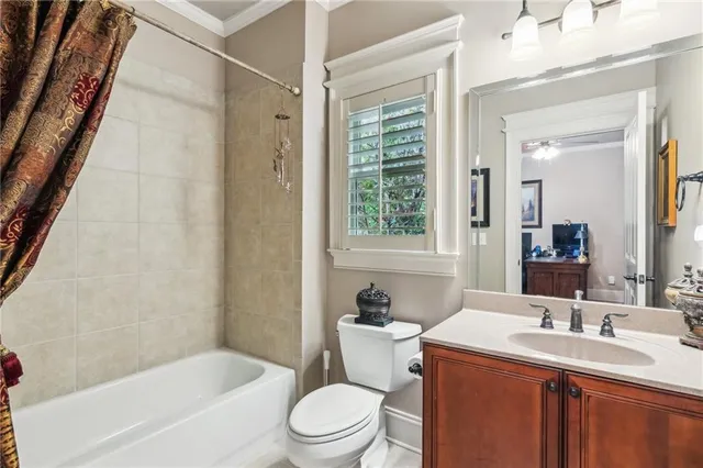 a en suite bathroom with a sink double vanity and a mirror