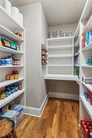 a bathroom with a toilet a sink and a mirror