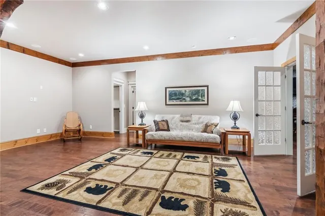 a living room with a couch a rug and a fireplace