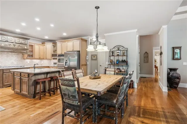a kitchen with granite countertop stainless steel appliances a sink and counter space