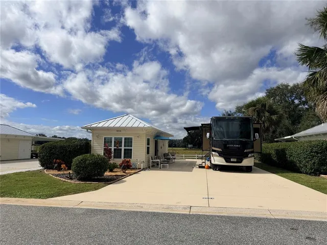 a view of a house with sitting area and entertaining space