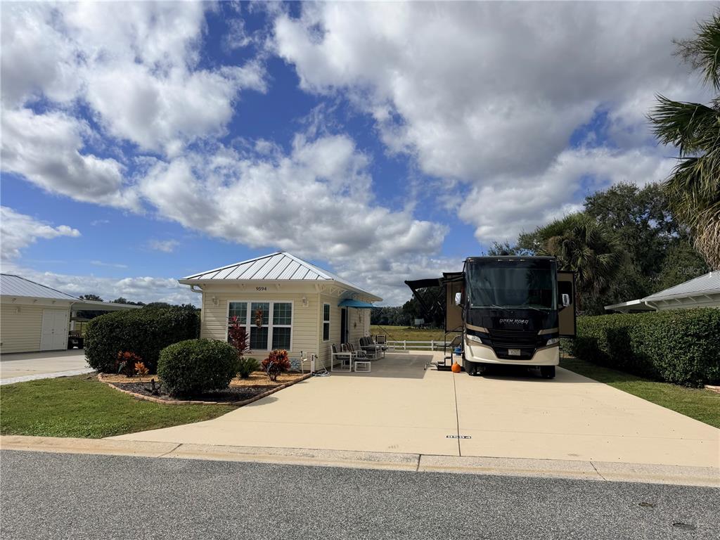 a view of a house with sitting area and entertaining space