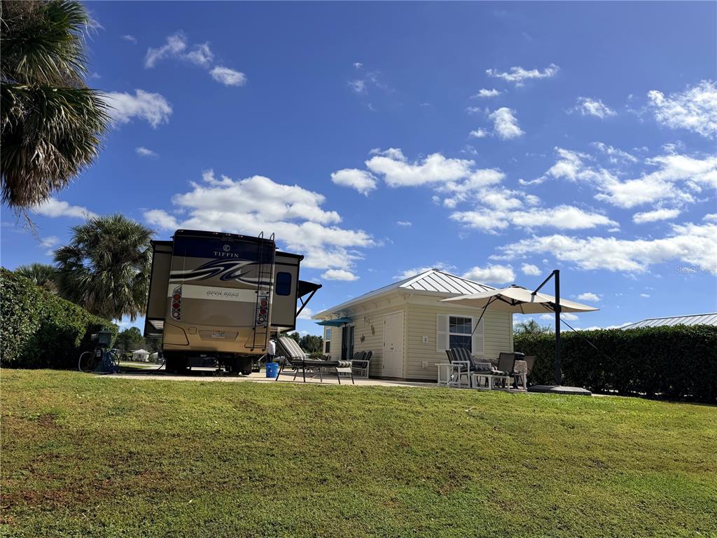 9594 Southeast 47th Way Webster, FL 33597 - Photo 13 of 50 a view of a house with a back yard