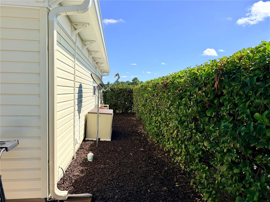 9594 Southeast 47th Way Webster, FL 33597 - Photo 17 of 50 a view of a house with a yard