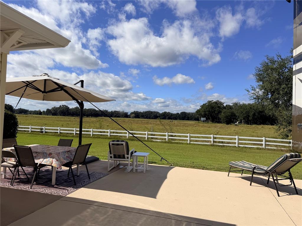 9594 Southeast 47th Way Webster, FL 33597 - Photo 18 of 50 a view of a lake with a sitting area