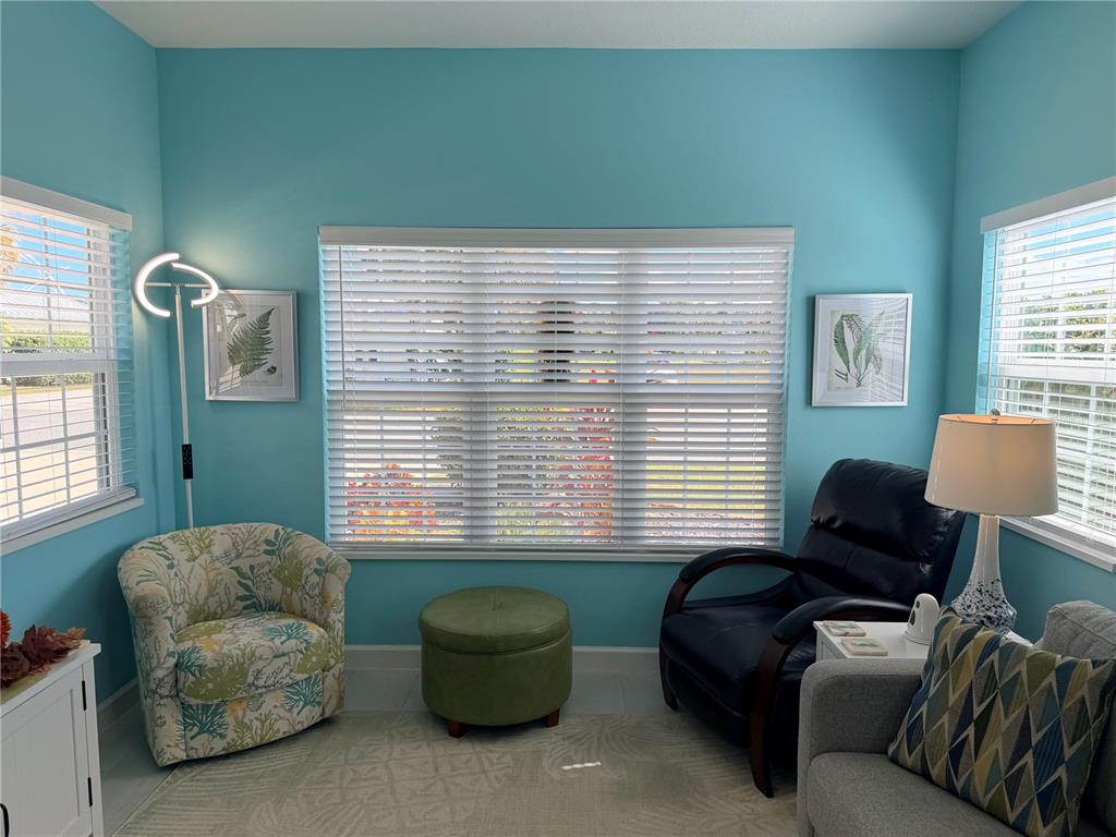 9594 Southeast 47th Way Webster, FL 33597 - Photo 21 of 50 a living room with furniture and a window