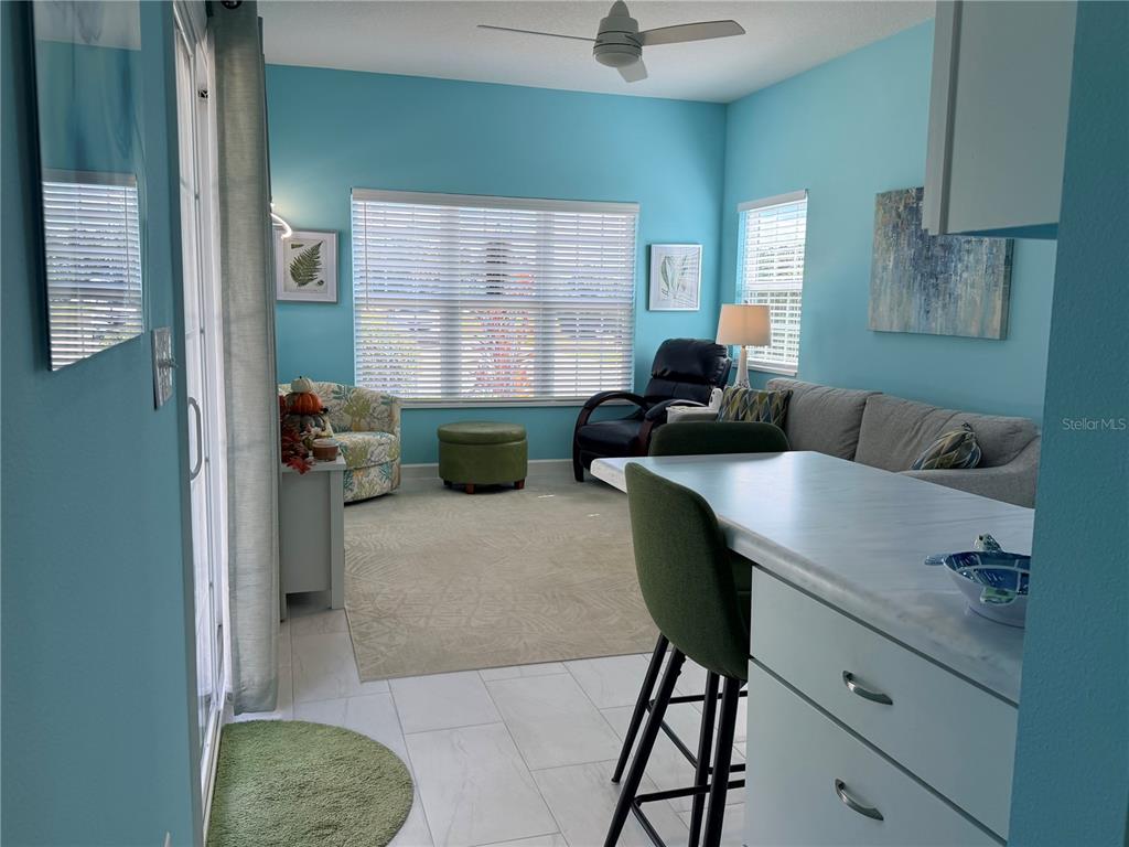 9594 Southeast 47th Way Webster, FL 33597 - Photo 28 of 50 a living room with furniture and a window