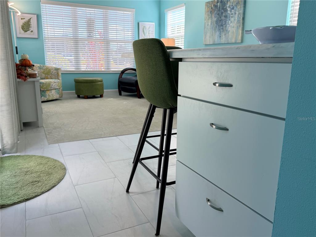9594 Southeast 47th Way Webster, FL 33597 - Photo 29 of 50 a view of a kitchen with furniture and a window