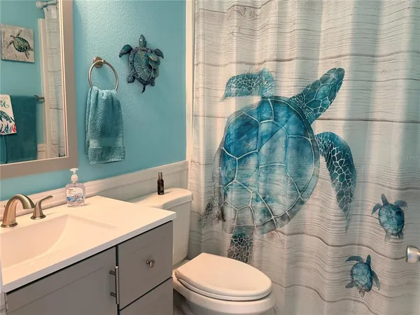 a bathroom with a sink and mirror