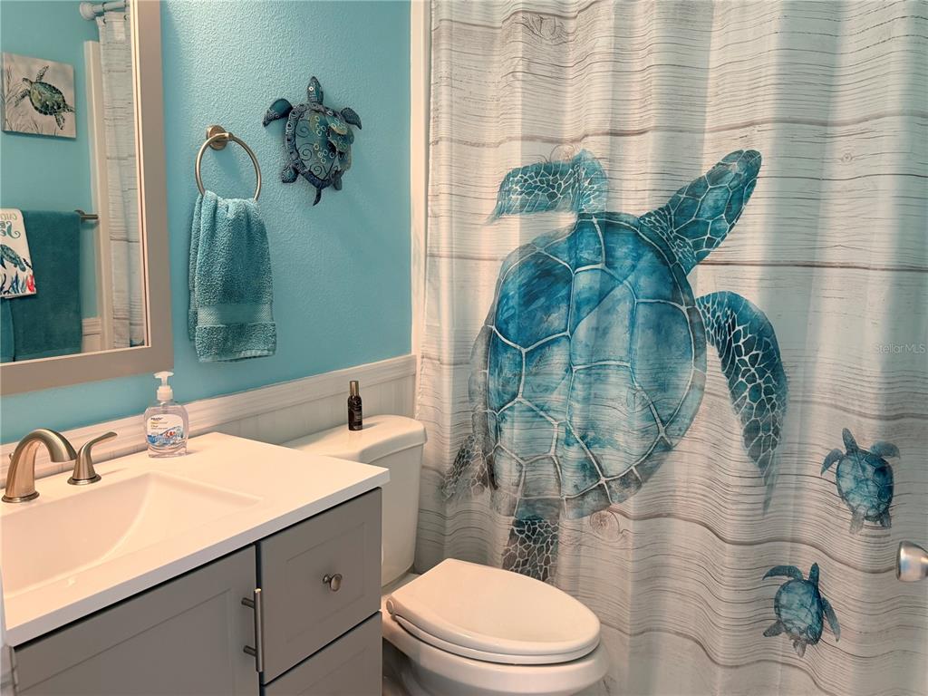 9594 Southeast 47th Way Webster, FL 33597 - Photo 30 of 50 a bathroom with a sink and mirror