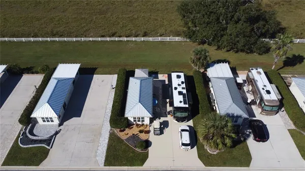 an aerial view of a house having patio