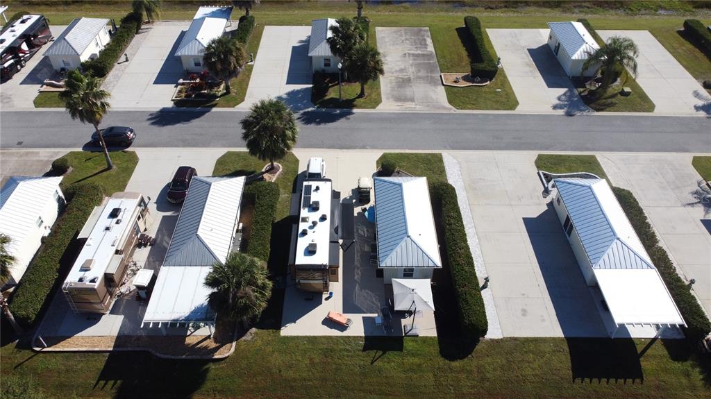 9594 Southeast 47th Way Webster, FL 33597 - Photo 7 of 50 an aerial view of houses with outdoor space