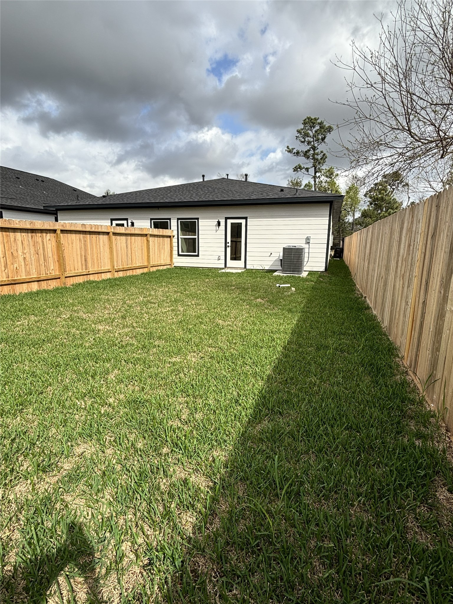 8218 Locksley Road, Unit A/B Houston, TX 77078 - Photo 11 of 11 a view of a house with backyard and garden