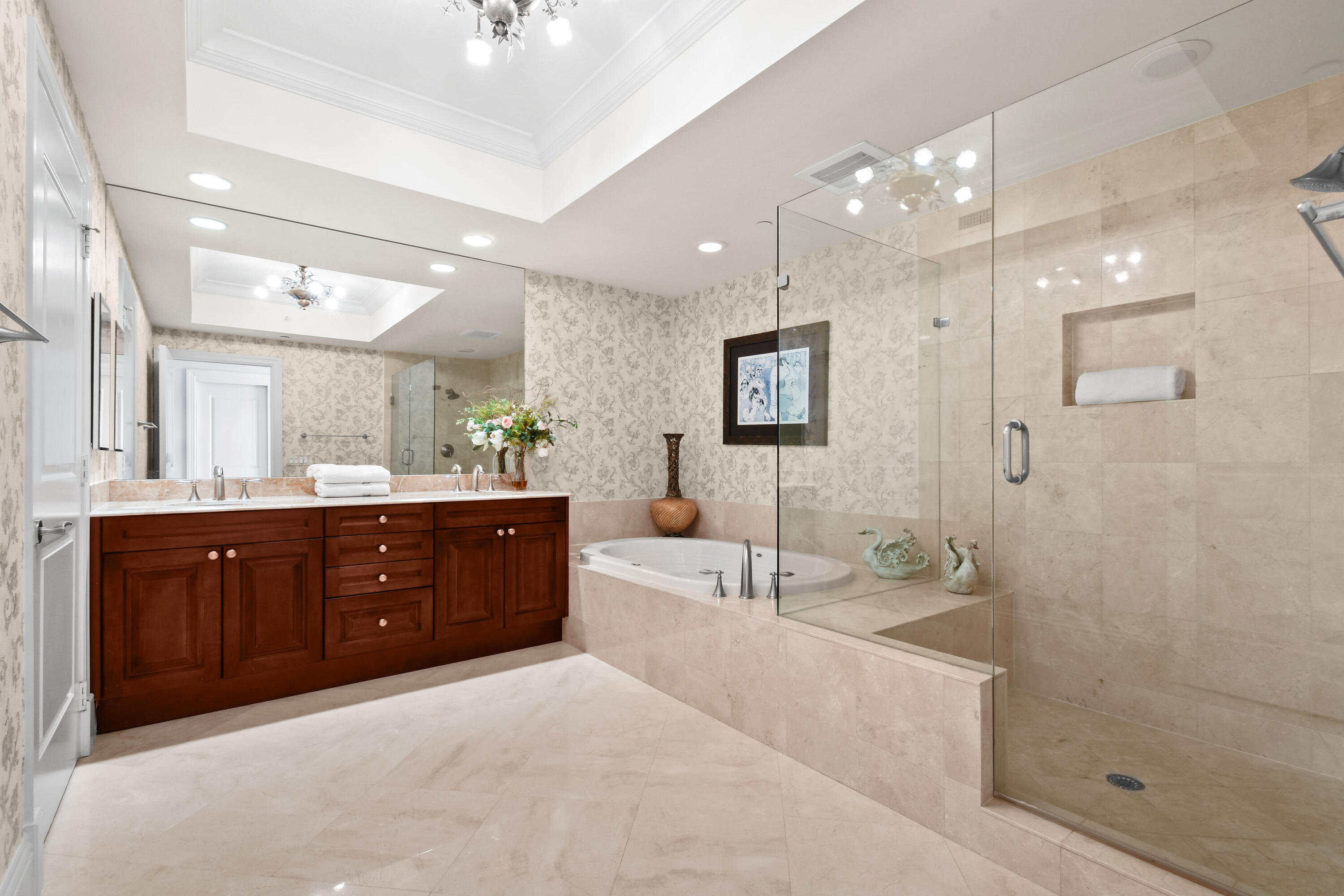 5050 North Ocean Drive, Unit 702 Singer Island, FL 33404 - Photo 11 of 40 a spacious bathroom with a tub sink shower and mirror