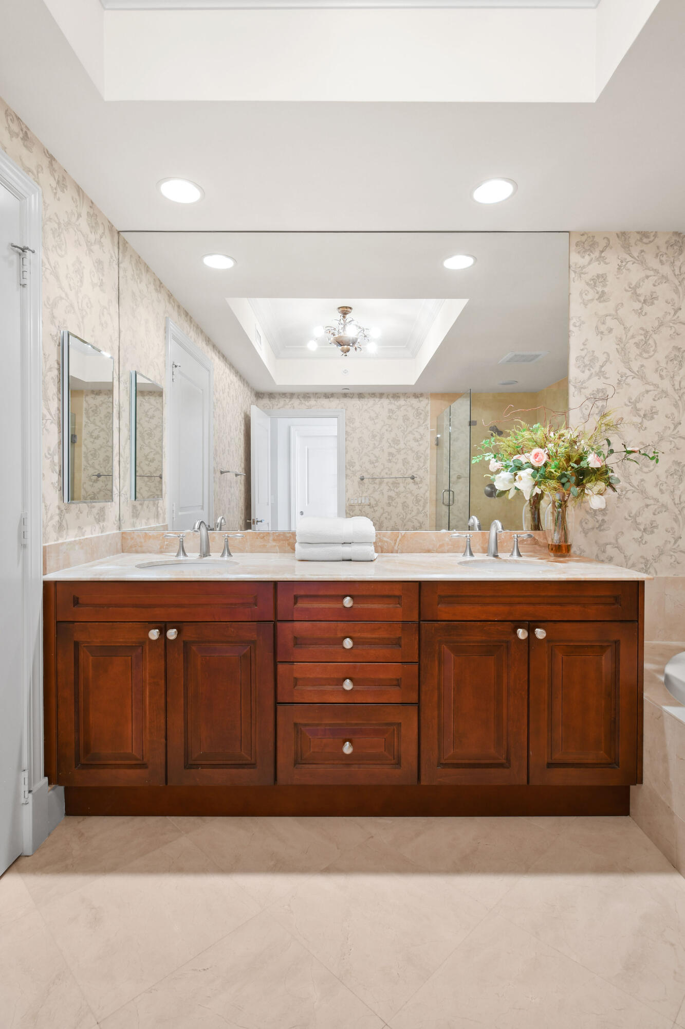 5050 North Ocean Drive, Unit 702 Singer Island, FL 33404 - Photo 12 of 40 a bathroom with a sink double vanity and a mirror