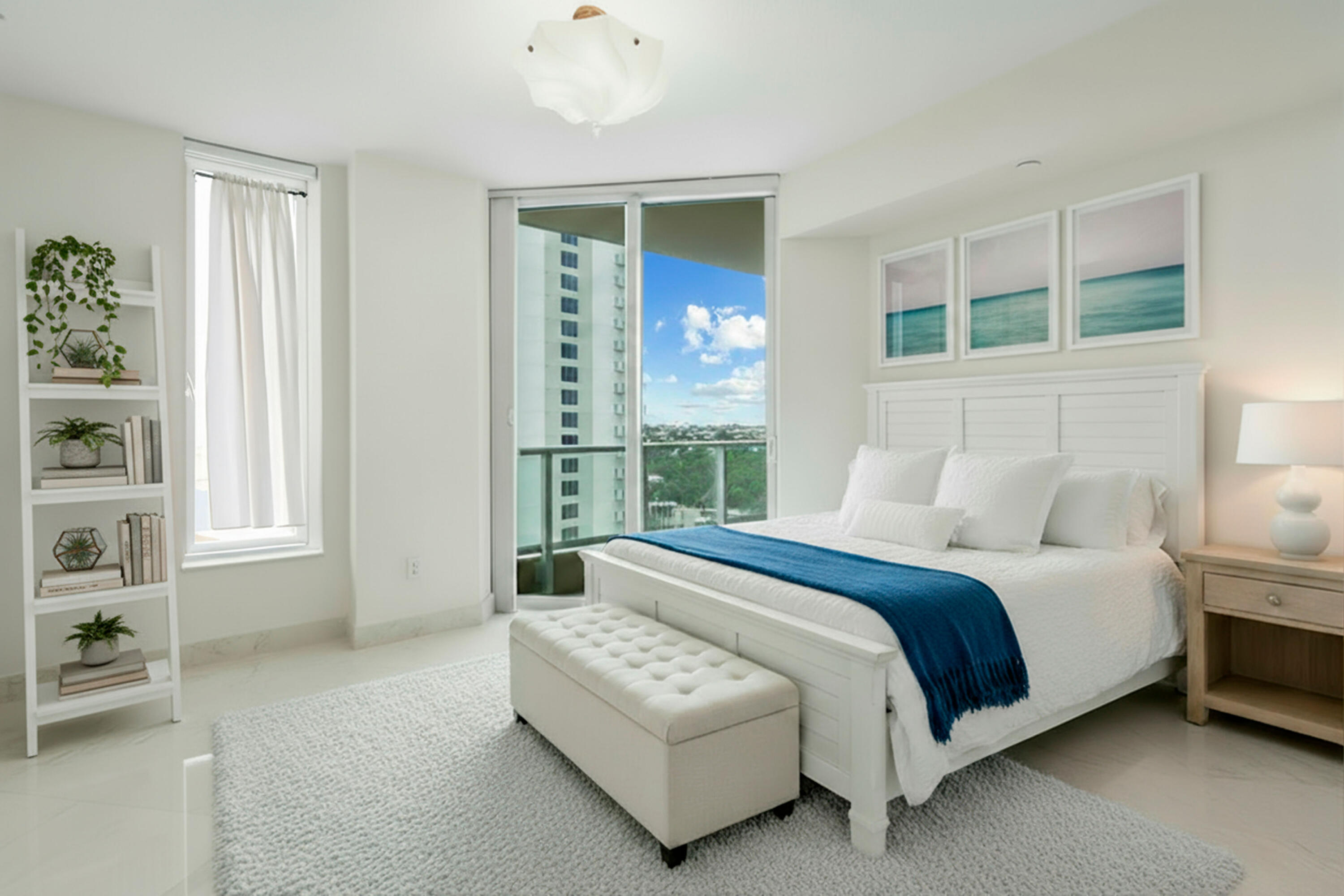 5050 North Ocean Drive, Unit 702 Singer Island, FL 33404 - Photo 19 of 40 a spacious bedroom with a bed and a window