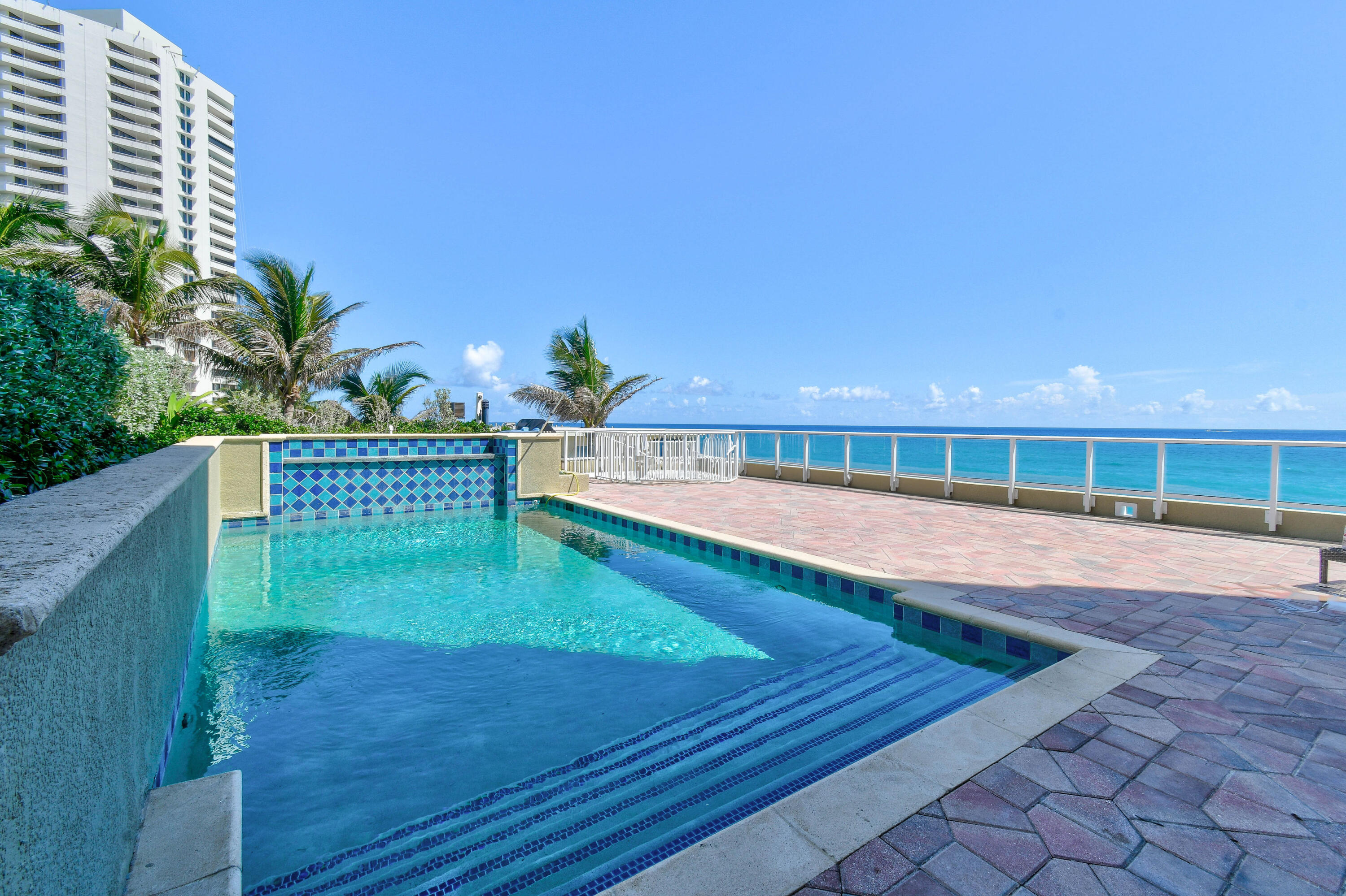 5050 North Ocean Drive, Unit 702 Singer Island, FL 33404 - Photo 26 of 40 a view of a swimming pool with a patio