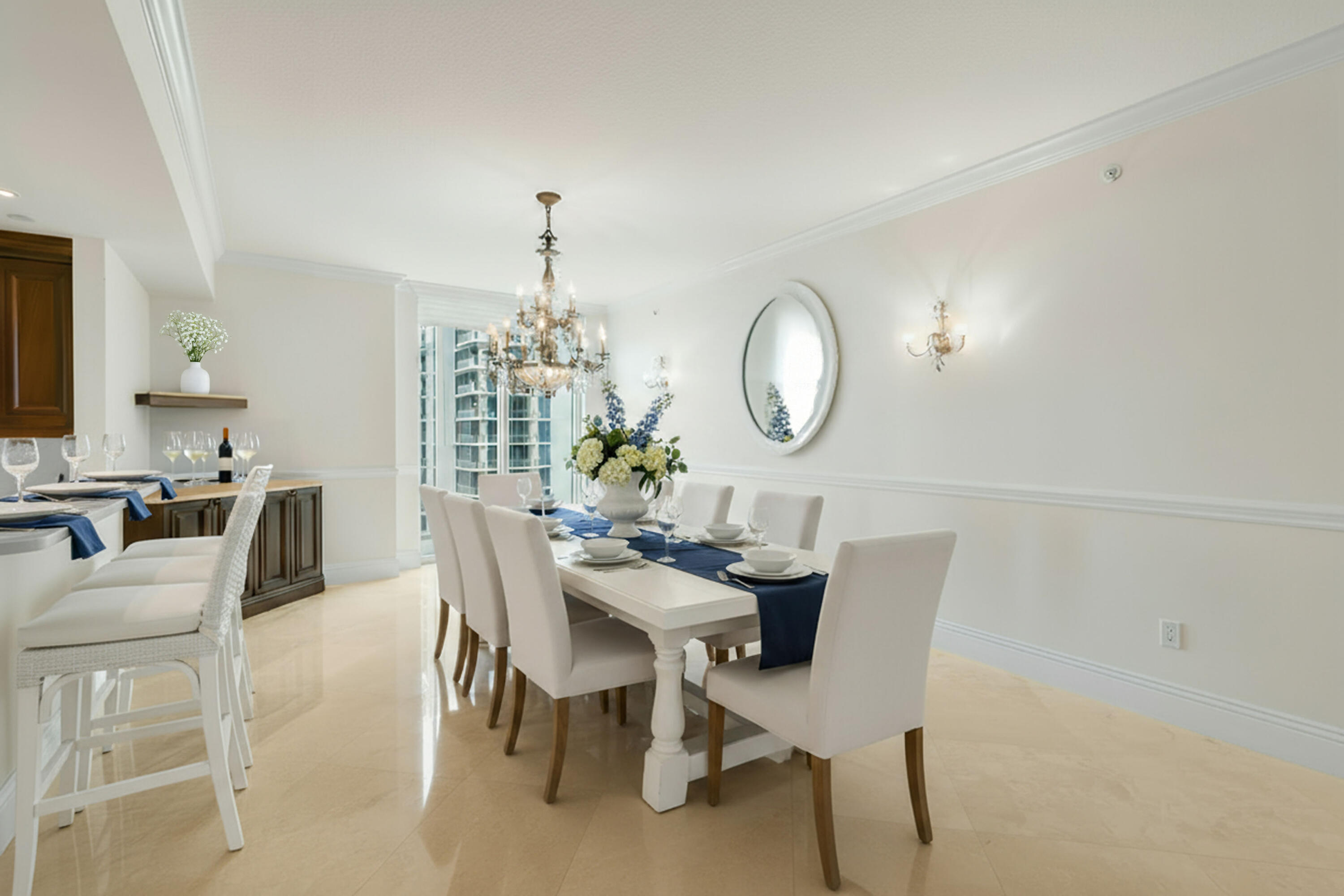 5050 North Ocean Drive, Unit 702 Singer Island, FL 33404 - Photo 9 of 40 a view of a dining room with furniture and a chandelier