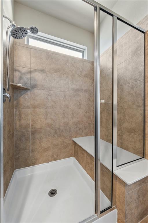 109 Hunt's Link Road Dripping Springs, TX 78620 - Photo 15 of 27 a bathroom with a tub and shower