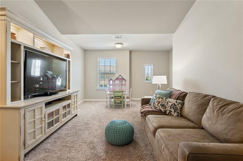 109 Hunt's Link Road Dripping Springs, TX 78620 - Photo 17 of 27 a living room with furniture and a flat screen tv
