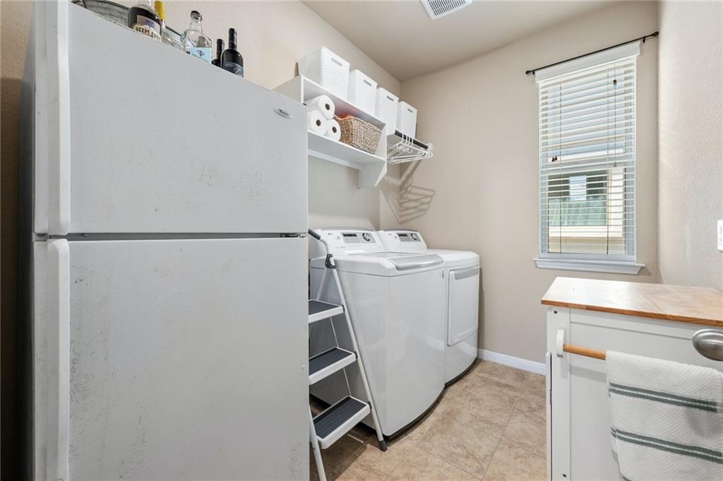 109 Hunt's Link Road Dripping Springs, TX 78620 - Photo 25 of 27 a utility room with dryer and washer