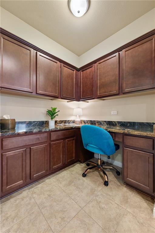 109 Hunt's Link Road Dripping Springs, TX 78620 - Photo 6 of 27 a kitchen with a sink cabinets and wooden floor