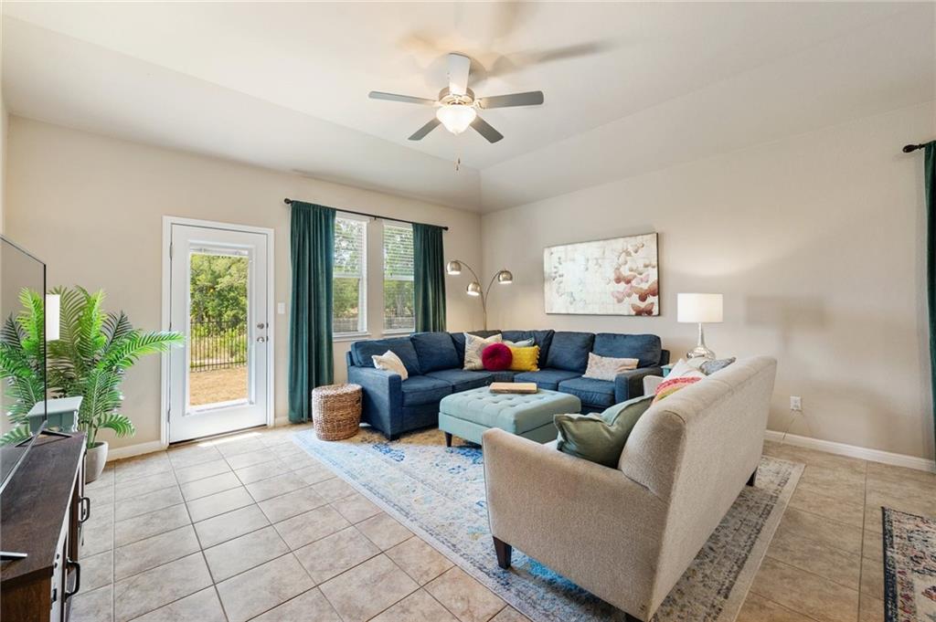 109 Hunt's Link Road Dripping Springs, TX 78620 - Photo 8 of 27 a living room with furniture and a large window