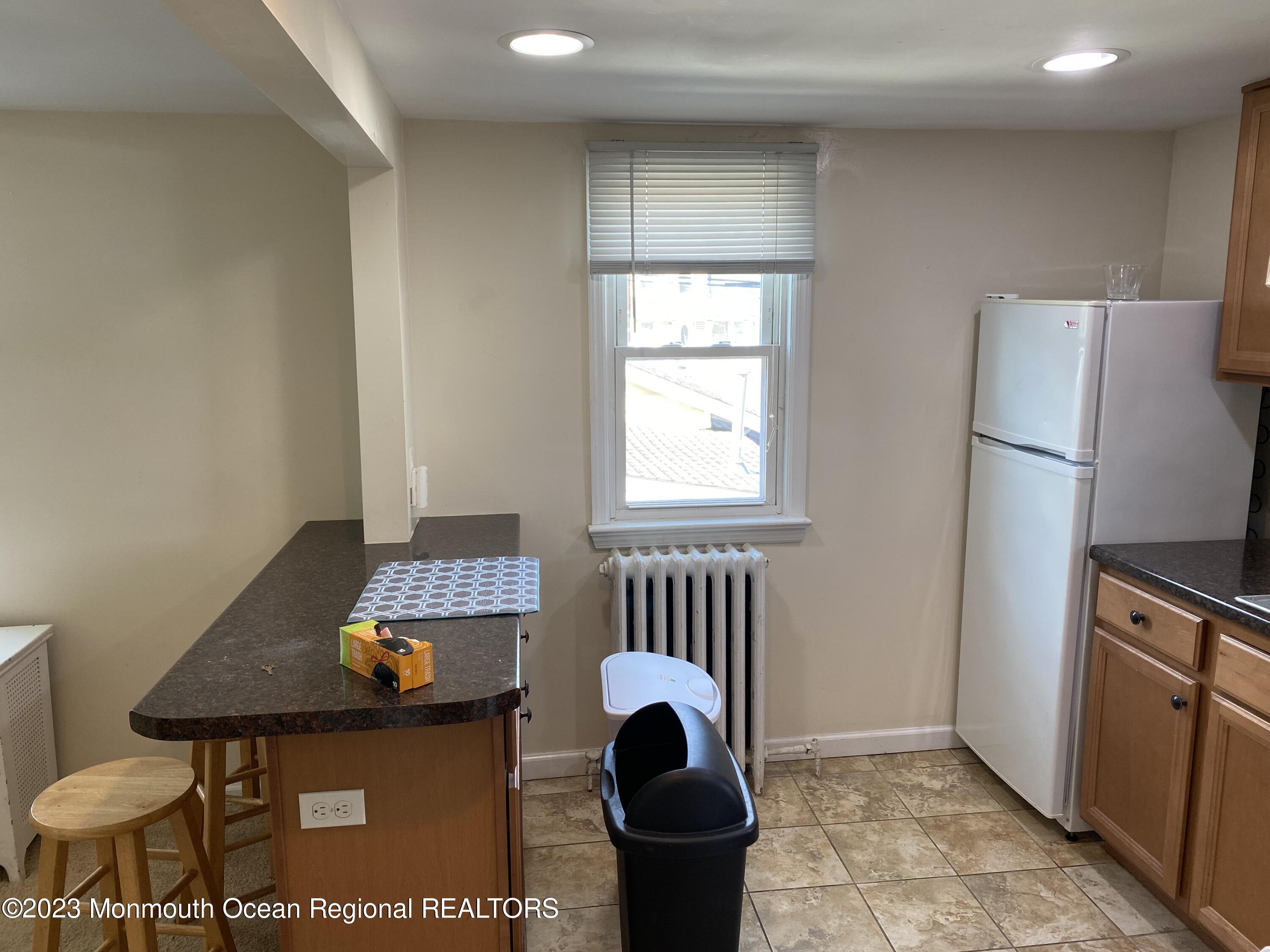 1802 Pine Terrace Lake Como, NJ 07719 - Photo 4 of 9 a room with furniture and a window
