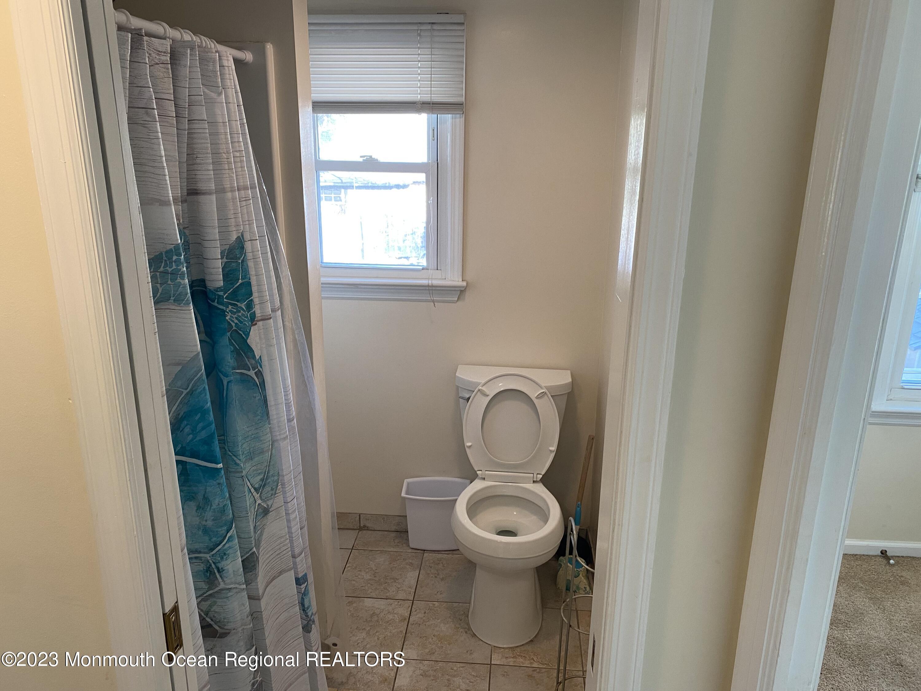 1802 Pine Terrace Lake Como, NJ 07719 - Photo 8 of 9 a bathroom with a toilet and a shower
