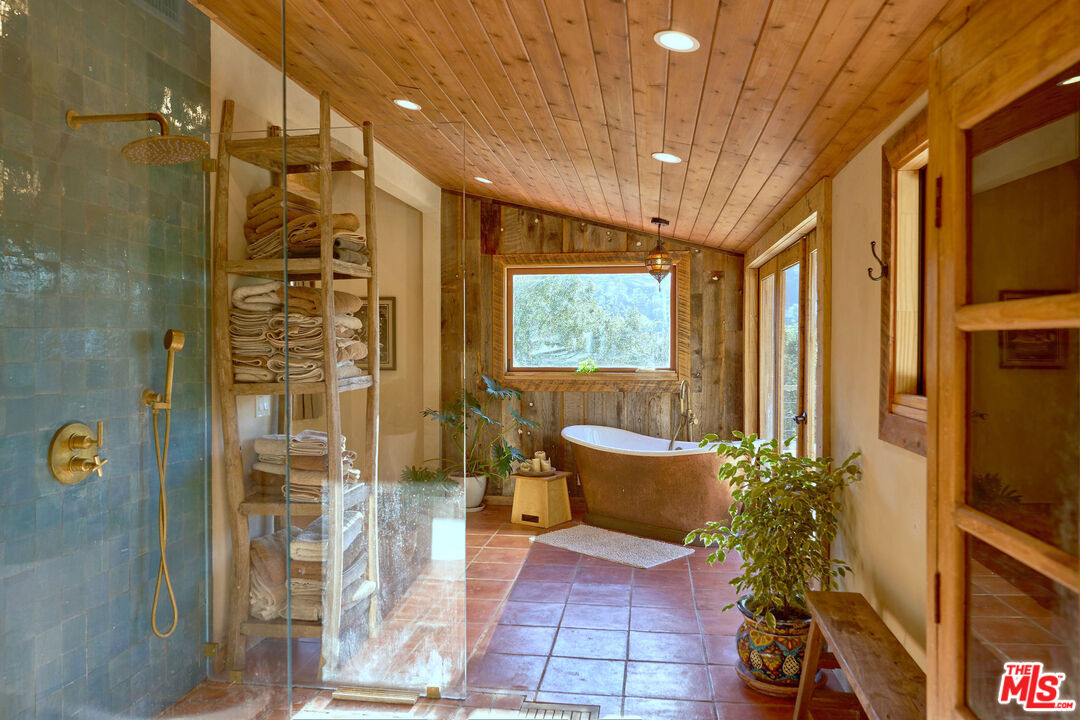 22068 Topanga School Road Topanga, CA 90290 - Photo 20 of 70 a living room with furniture and a potted plant
