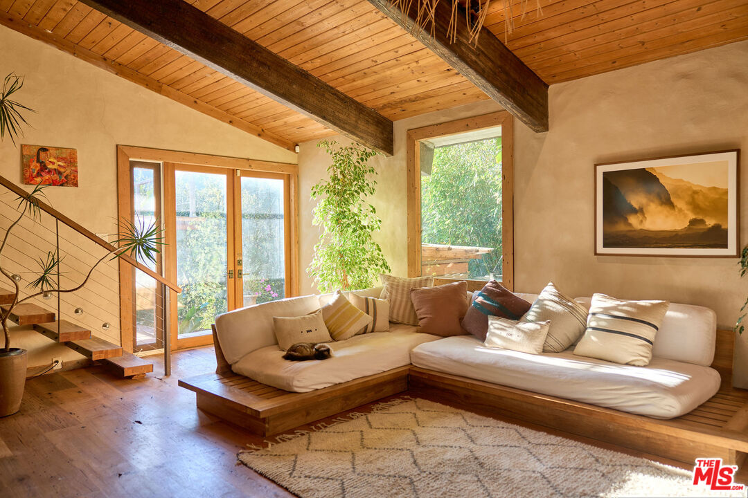 22068 Topanga School Road Topanga, CA 90290 - Photo 2 of 70 a living room with furniture and a large window