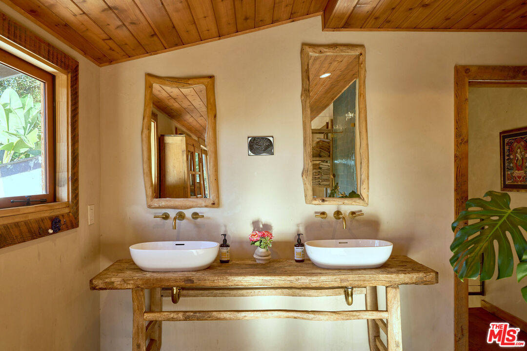 22068 Topanga School Road Topanga, CA 90290 - Photo 21 of 70 a bathroom with a sink and a mirror
