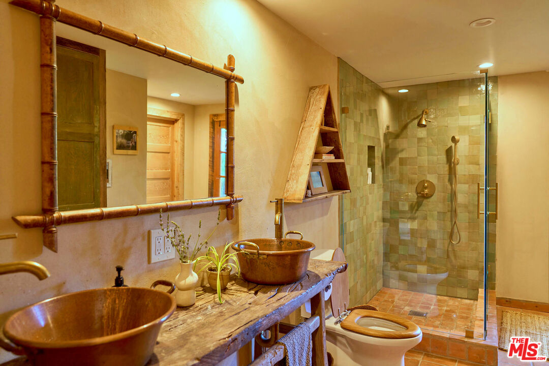 22068 Topanga School Road Topanga, CA 90290 - Photo 25 of 70 a bathroom with a sink a toilet and shower