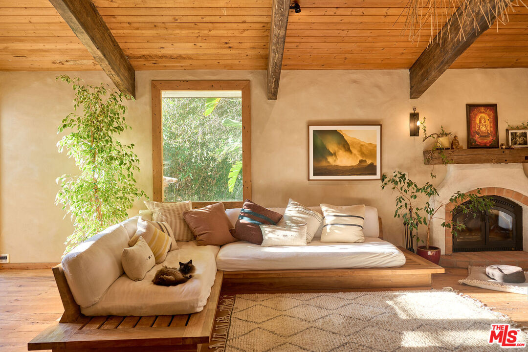 22068 Topanga School Road Topanga, CA 90290 - Photo 3 of 70 a living room with furniture and a fireplace
