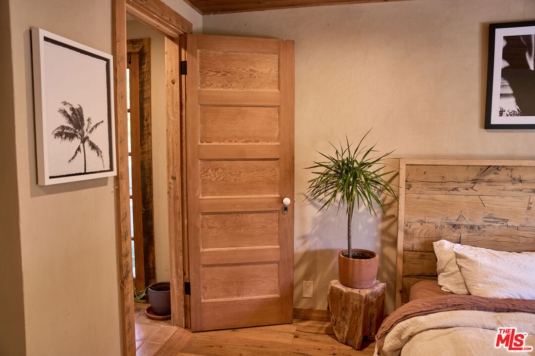 22068 Topanga School Road Topanga, CA 90290 - Photo 35 of 70 a view of a bedroom with a bed and furniture