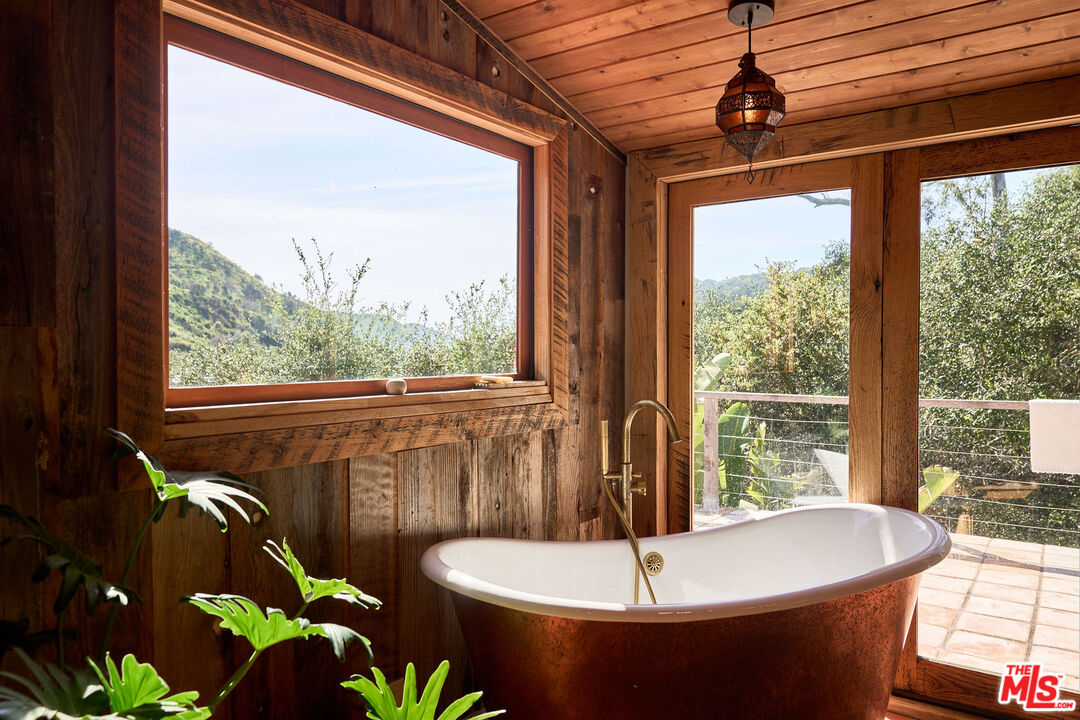 22068 Topanga School Road Topanga, CA 90290 - Photo 42 of 70 a bath tub sitting in front of a window