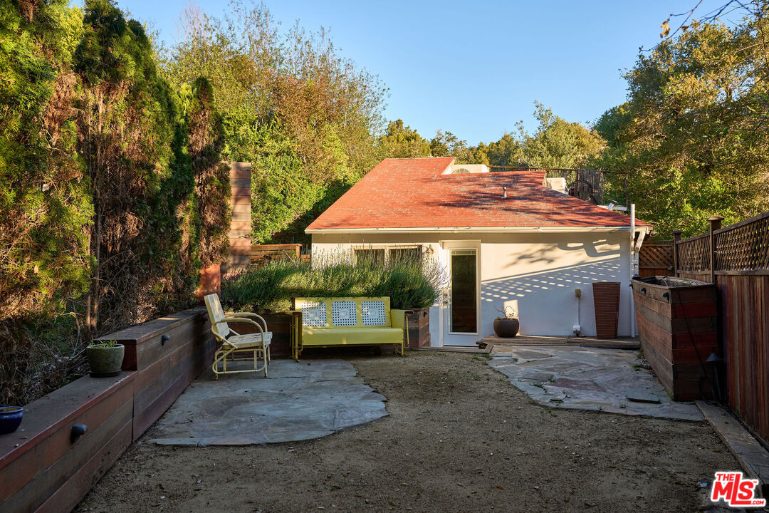 22068 Topanga School Road Topanga, CA 90290 - Photo 44 of 70 a view of a chairs and table in the backyard