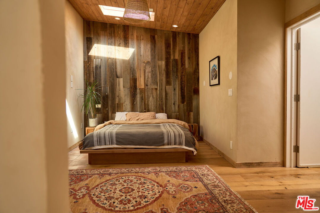 22068 Topanga School Road Topanga, CA 90290 - Photo 46 of 70 a bedroom with a bed and a window