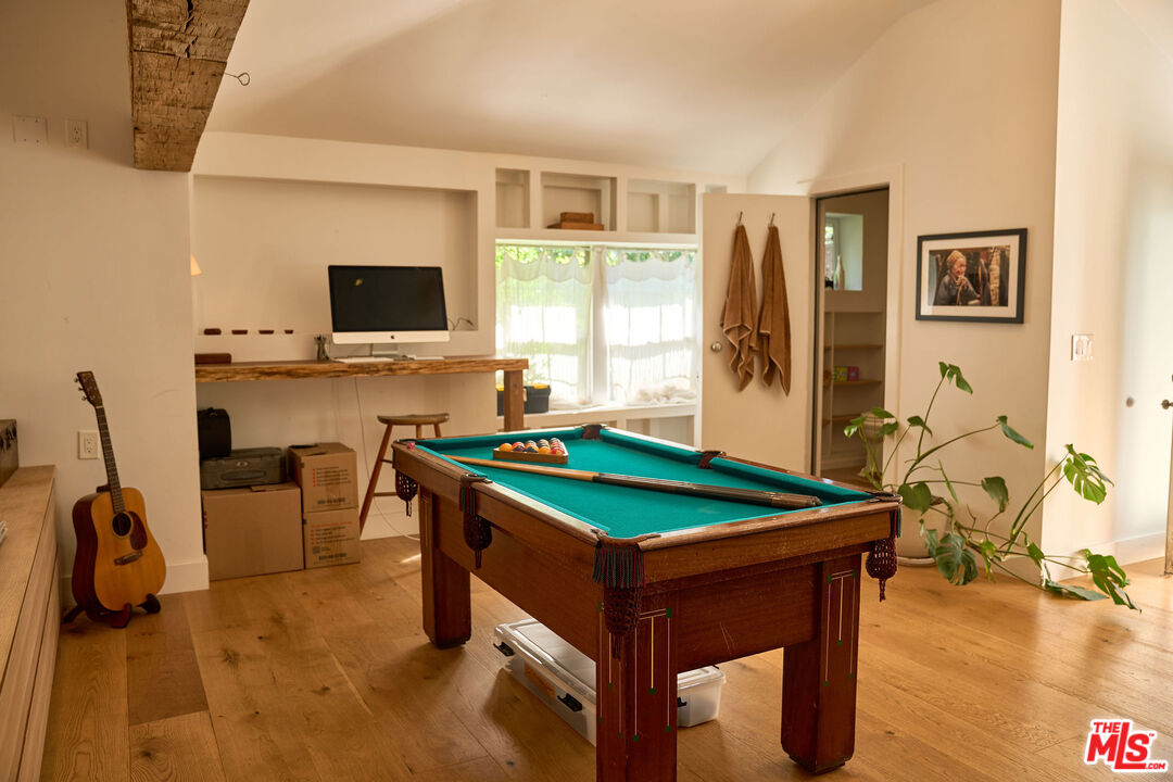 22068 Topanga School Road Topanga, CA 90290 - Photo 47 of 70 a room with furniture and a flat screen tv