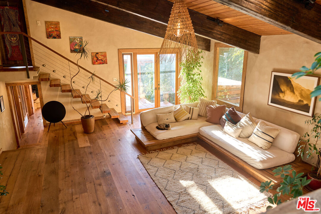 22068 Topanga School Road Topanga, CA 90290 - Photo 5 of 70 a living room with furniture and a large window