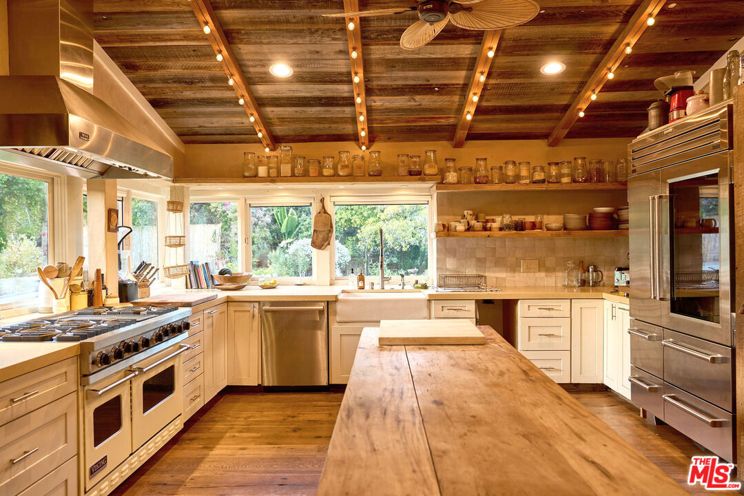 22068 Topanga School Road Topanga, CA 90290 - Photo 8 of 70 a large kitchen with lots of counter top space and appliances