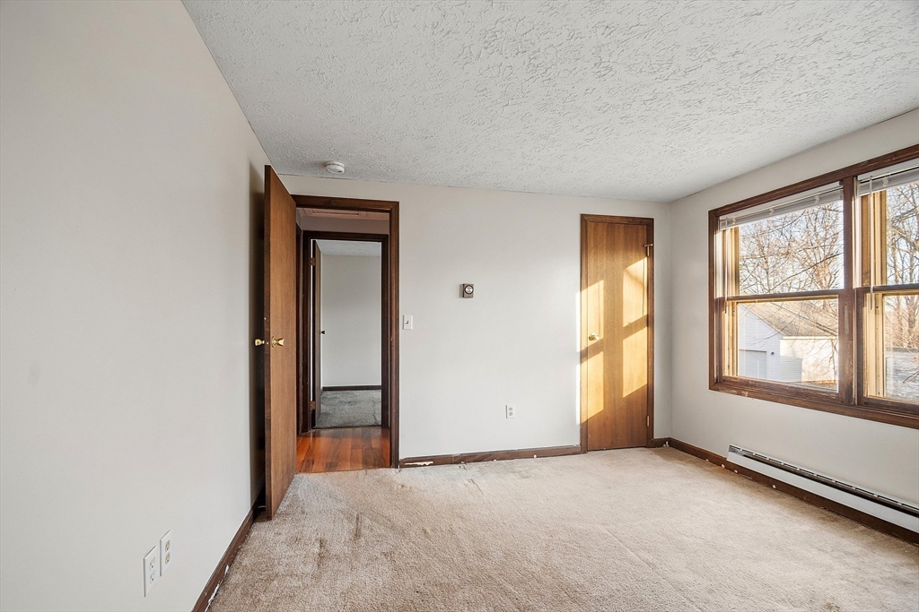 5 Catherine Street Clinton, MA 01510 - Photo 17 of 29 an empty room with windows and closet