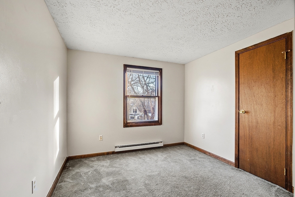 5 Catherine Street Clinton, MA 01510 - Photo 18 of 29 a view of an empty room with window