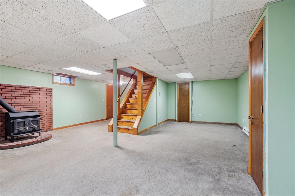 5 Catherine Street Clinton, MA 01510 - Photo 21 of 29 a view of an empty room with a fireplace