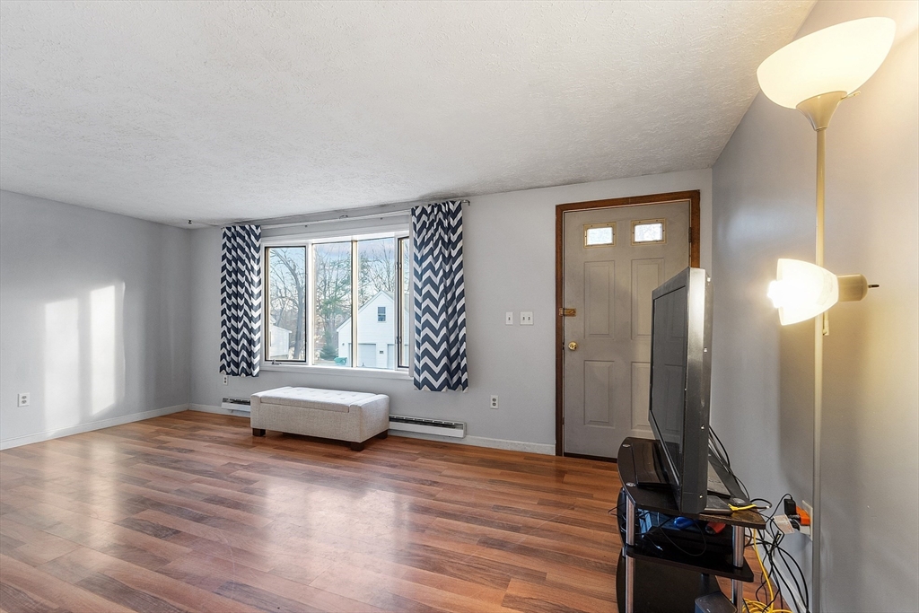 5 Catherine Street Clinton, MA 01510 - Photo 10 of 29 a view of a livingroom with furniture and windows