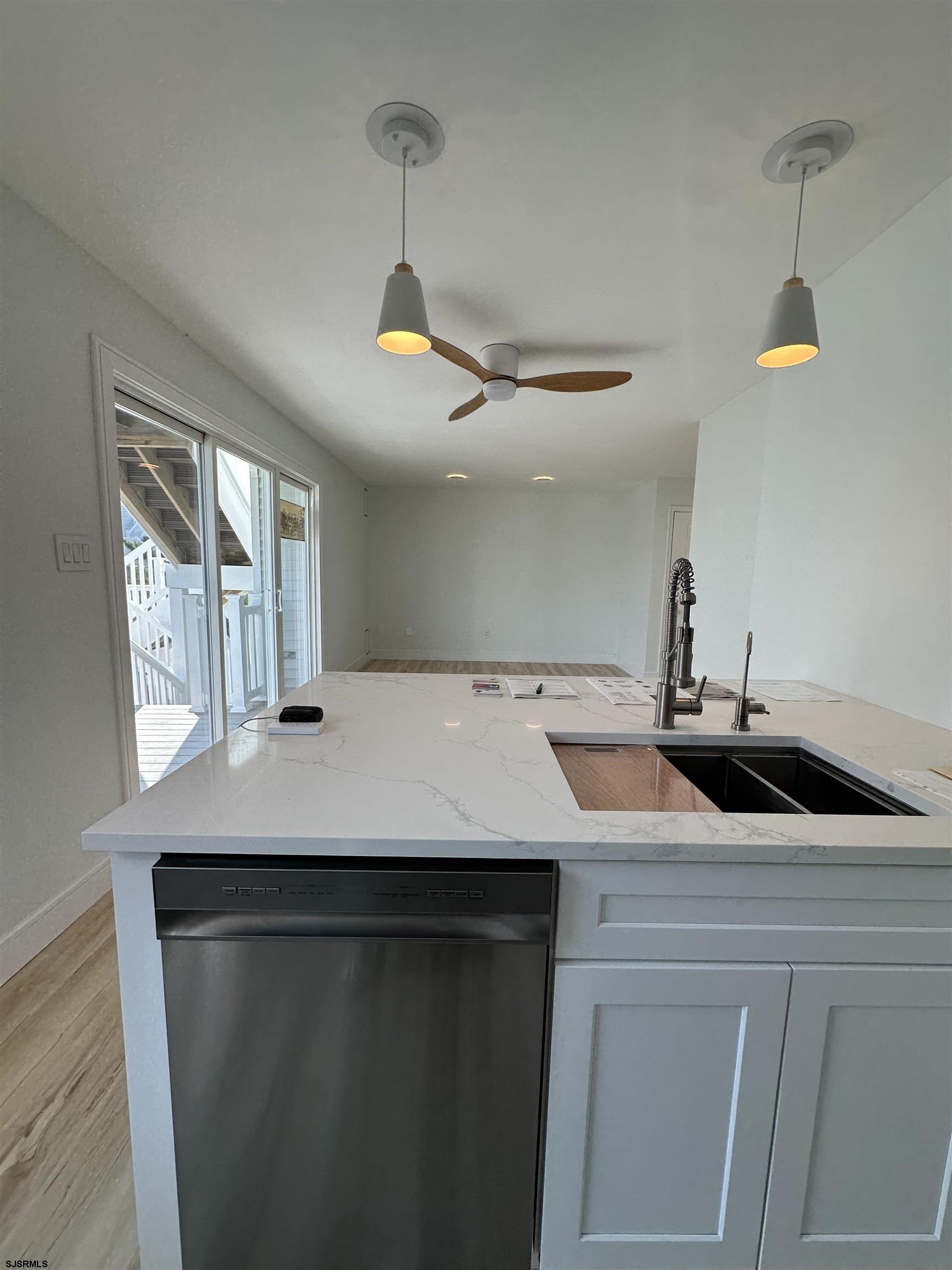 169 40th Street South, Unit 38 Brigantine, NJ 08203 - Photo 23 of 79 a kitchen with a sink a counter space and a window