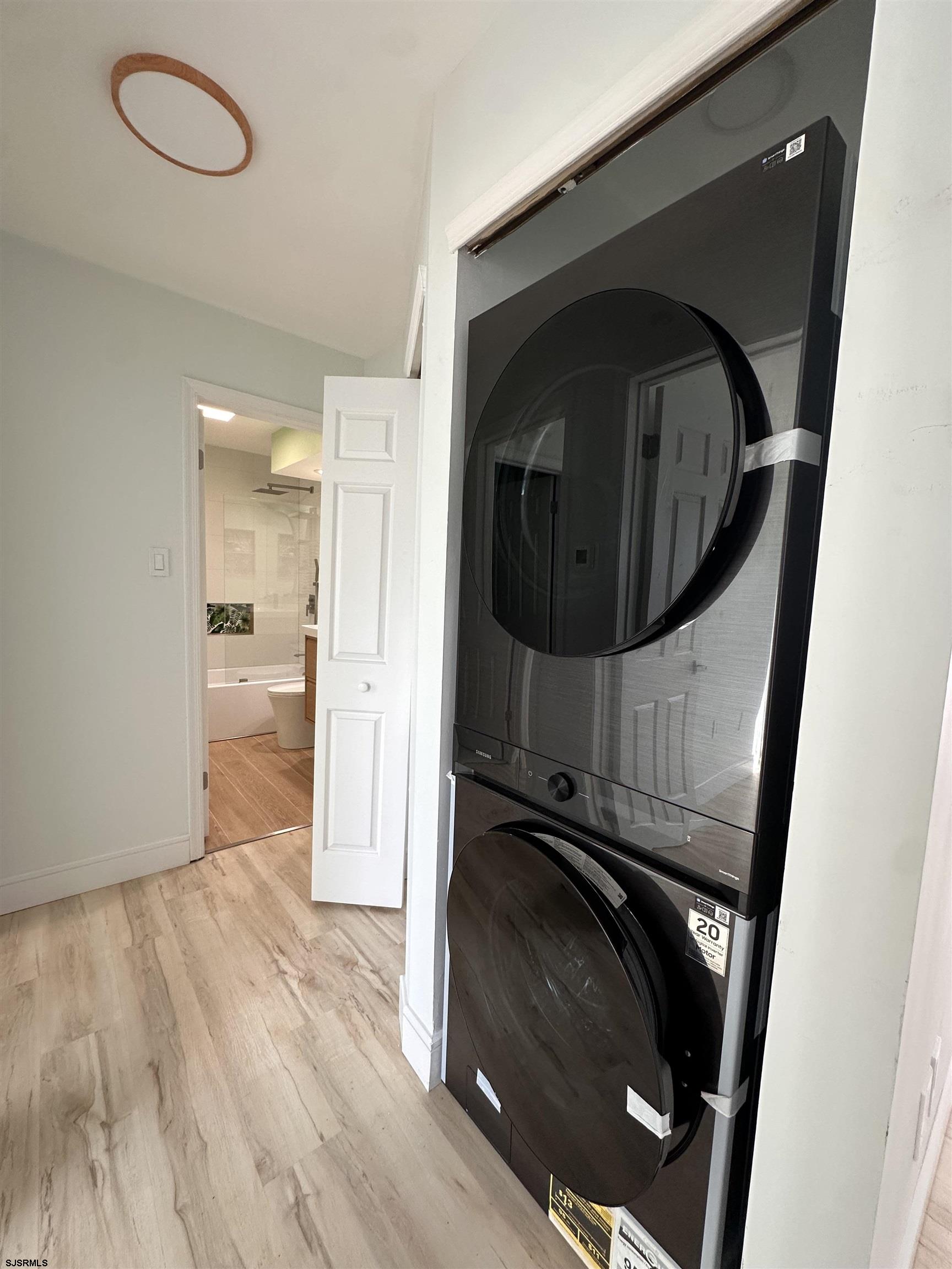 169 40th Street South, Unit 38 Brigantine, NJ 08203 - Photo 30 of 79 a view of a hallway with wooden floor and staircase
