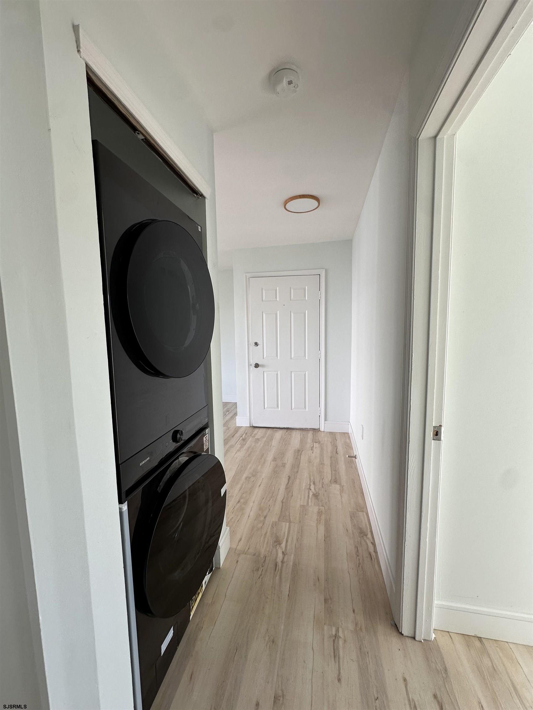 169 40th Street South, Unit 38 Brigantine, NJ 08203 - Photo 32 of 79 a view of a storage and utility room with wooden floor